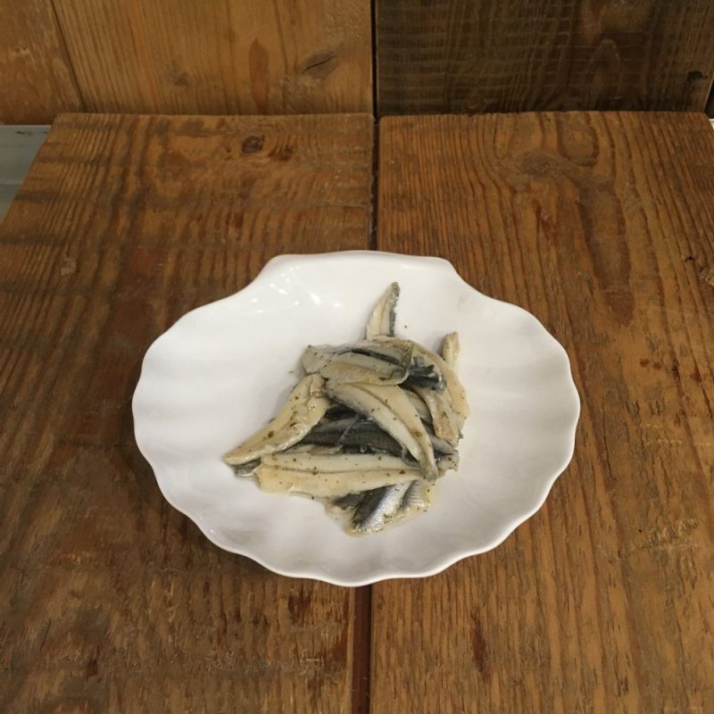 Anchovies in oil with garlic and herbs